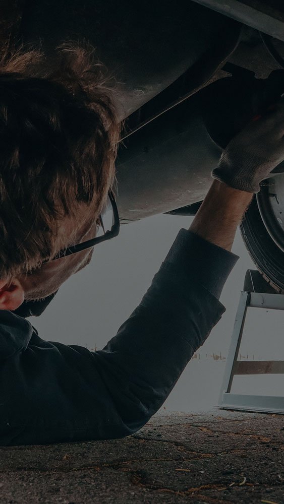 Mechanic fixing a vehicle